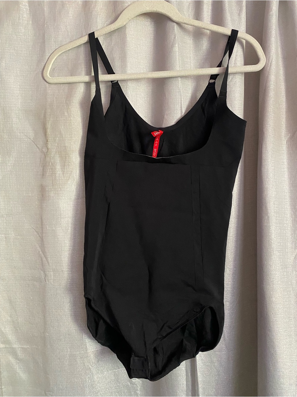 the Spanx OnCore Open-Bust Brief Bodysuit in black size XL
